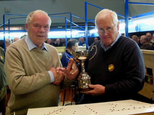 The Denis Moore Cup being presented