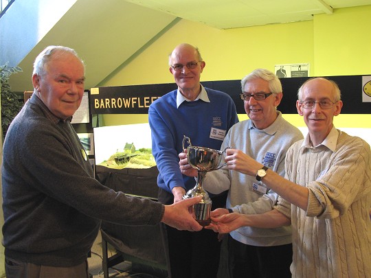 The Denis Moore Cup being presented